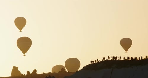 Hot Air Balloons over Desert at Sunrise