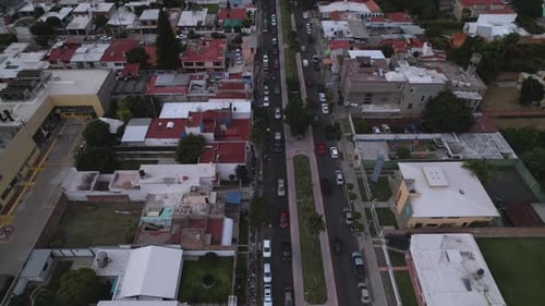 Aerial View of Cars and People in Neighborhood
