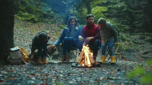 Portrait Family Sits Near Campfire on Autumn Evening Children with Their Parents are Resting in the