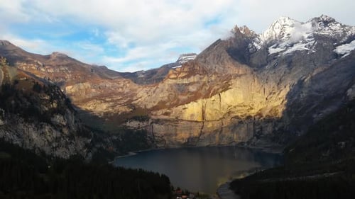 Aerial Timelapse of the Lake Oeschinensee at Sunset in Autumn