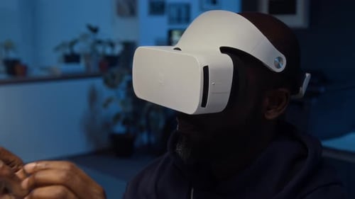 Close-up of Black IT Specialist Wearing VR Headset Testing Application