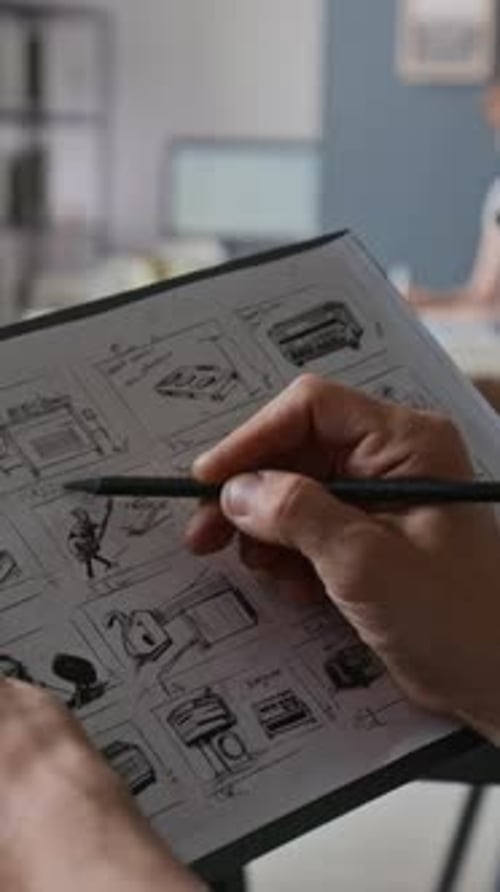 Unrecognizable Hand Drawing Storyboard on Set of Video Production Studio