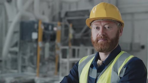 Factory Worker with Red Beard Wearing Yellow Hard Hat