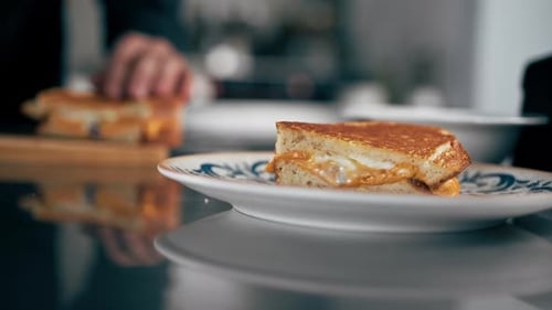 Grilled Cheese Sandwich being stacked on plate