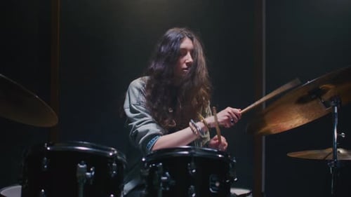 Woman Drummer Plays a Drum Kit Female Musician Beats a Rock Rhythm on Drums Girl Artist is