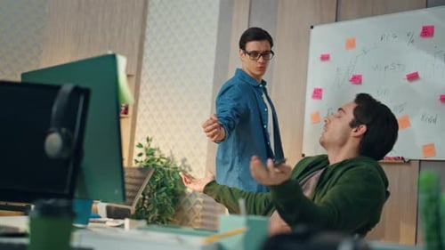 Two Men Working Together in Modern Office Setting