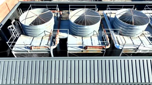 Drone view of an industrial HVAC system with cylindrical towers