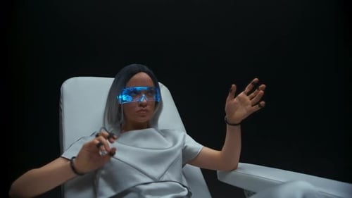 Woman Using Futuristic AR Interface in Dark Studio