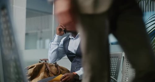 Airport Terminal Businessman Angry About Delayed Flight Holding Airplane Ticket Talking on