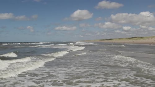 Aerial view, idyllic Dutch beach destination, ocean waves, shoreline