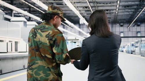 Soldier and Microchip Factory Engineer Discuss About Silicon Wafer