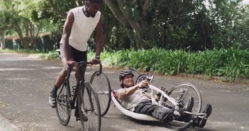 Fitness, sports and person with disability on bicycle in park for training