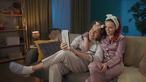 Smiling Couple on Video Call in Living Room
