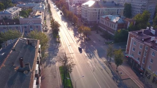 Top View of Beautiful City Road with Car on Sunny Day