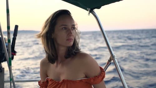 Pensive, Sad Woman Sailing Boat on Sea 30s