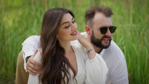 Young Couple in Love in Green Grass