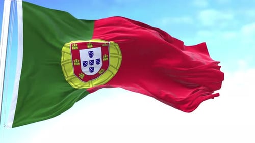 Portugal National Flag Waving Realistically Against Blue Sky