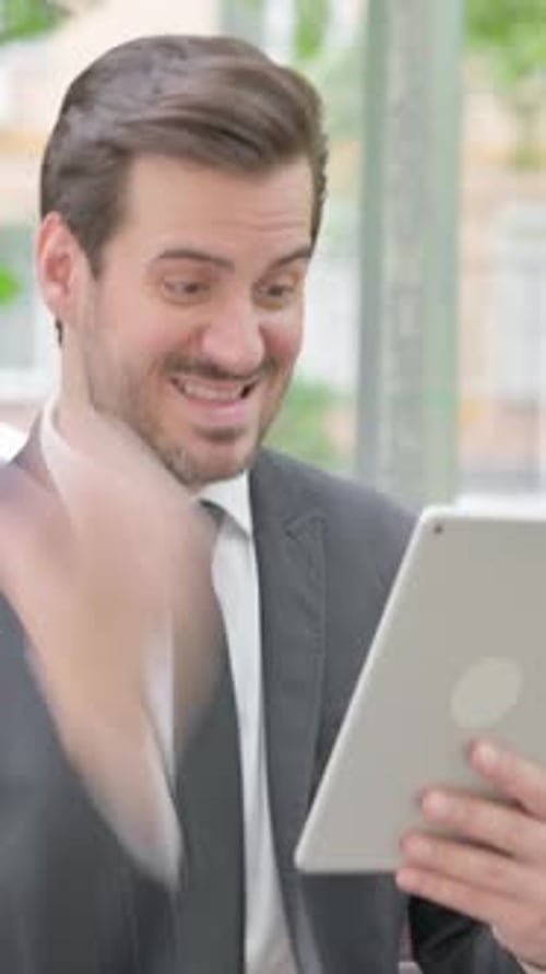 Young Businessman Upset by Loss on Tablet Outdoor, vertical video