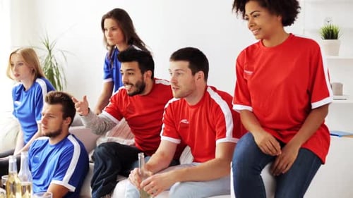 Enthusiastic Friends Watch Sports in Living Room