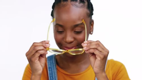 Face, black woman and glasses for clear vision, excited and happy girl isolated on white studio
