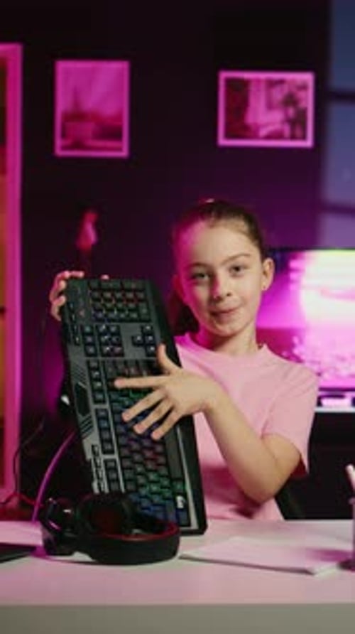 Little Girl Showcasing Computer Peripherals to Fans on Gen Z Online Channel