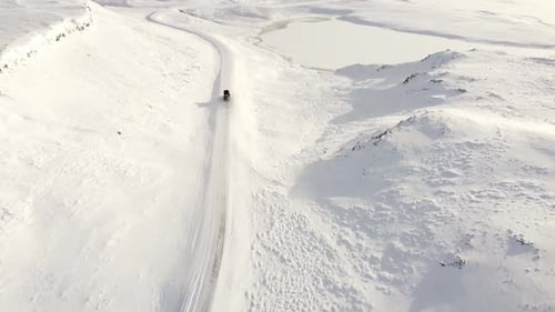 Snow Removal on the Roads in Iceland Aerial Panoramic View Snowy Roads in Winter Snow Plows Car for
