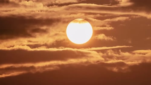 Big Sun Rising Above Morning Clouds Timelapse, Golden Sunrise with Glowing Solar Disk
