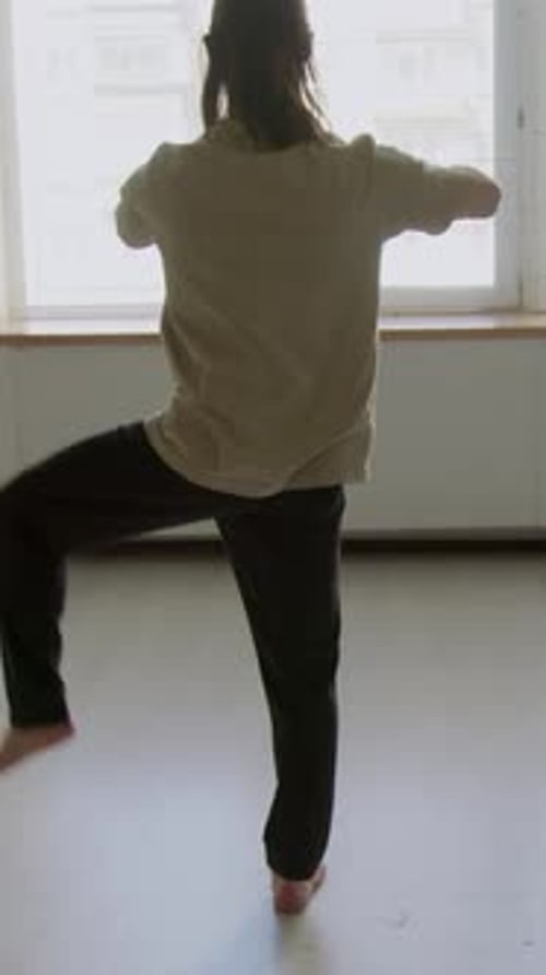 Rear View of Male Dancer Doing Standing Hip Circles