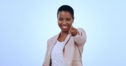 Black woman in studio with smile, pointing at you and opportunity with job recruitment business