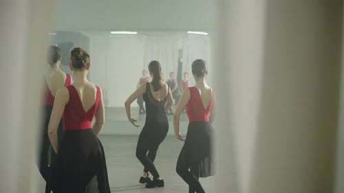 Women Practice Elegant Ballet Moves in Dance Studio