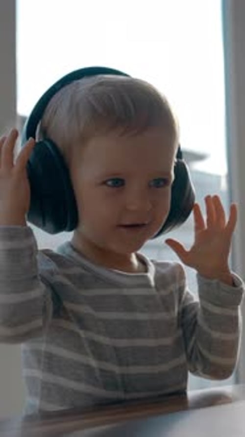 Child Listening to Music with Headphones