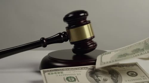 Gavel with Falling Currency