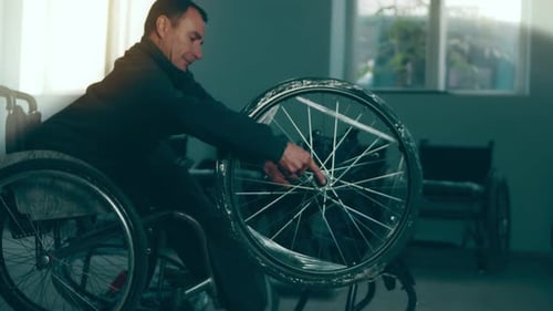 A Disabled Man Assembles a Stroller