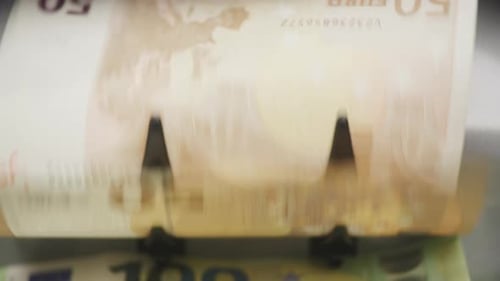 Euro Bills Being Counted by Money Counter Machine
