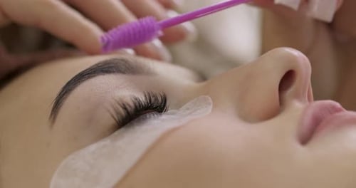 Eyelash Extension Application Using a Brush