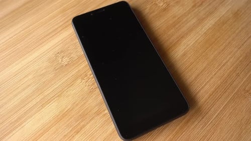 Black Smartphone Rotates as Background