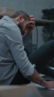 Depressed Businessman Sits on the Floor After Fit of Rage and ...