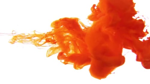 Bright Orange Liquid Swirling in Clear Water