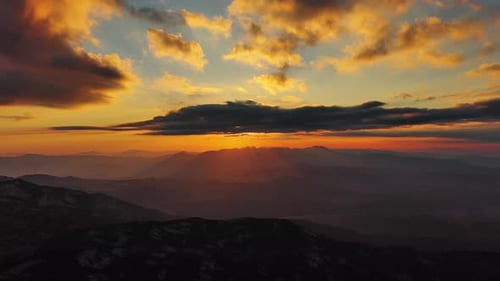 Sunset Over Mountain with Dramatic Clouds