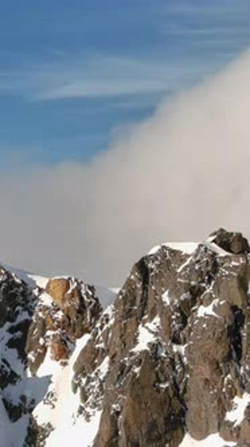 Snowy Mountain Peaks Under Blue Sky. British Columbia, Canada.