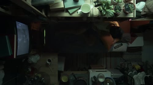 Top View of Asian Shoebox Flat Tenant Lying Down to Sleep