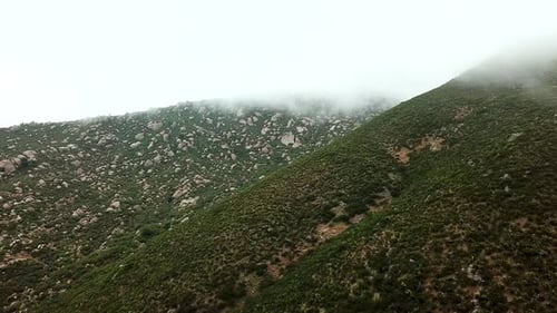 Mountain side clouded drone shot