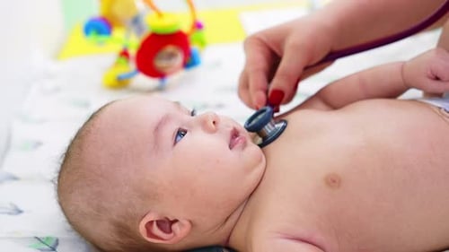 Infant Examined with Stethoscope in Doctor's Office