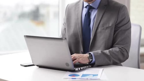 People, Business, Technology And Office Work Concept - Closeup Of Businessman Hands Typing On Lap...