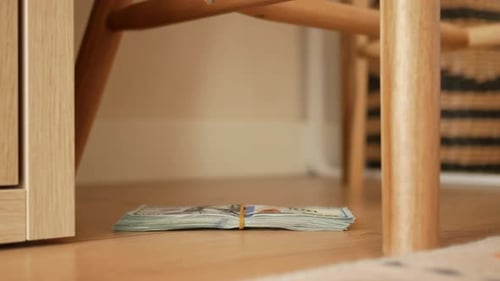 Cash Bundle Found Underneath Furniture in Living Area Lost Cash Concept
