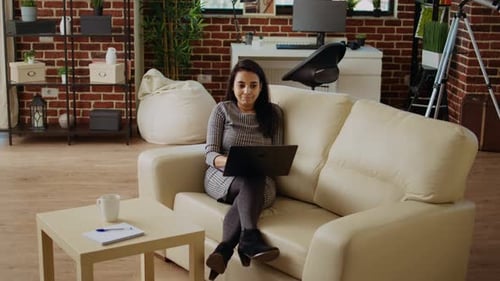Self Employed Woman Focused on Finishing Dull Monotonous Job Tasks From Home