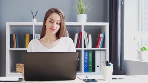 Young Woman Works at Home Office Using Computer Workplace of Female Entrepreneur Freelancer or