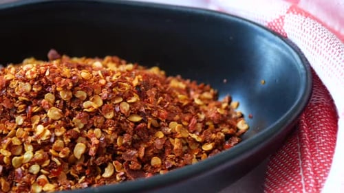 Red Chili Spice in a Bowl on Table