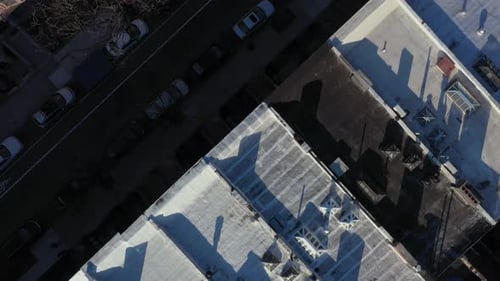 aerial close downward shot over the rooftops of Harlem New York City