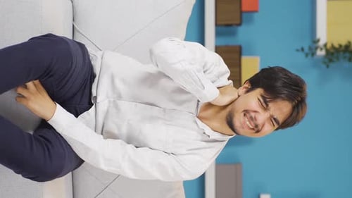 Vertical video of Man with neck pain.